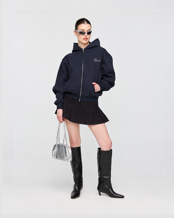 CAEVI Script Heavyweight Zip-Up Hoodie in Midnight – model styling view