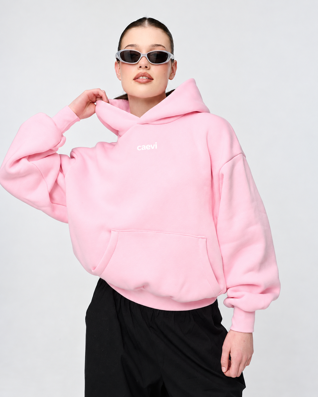 CAEVI Essential Heavyweight Hoodie in Powder Pink – model styling view
