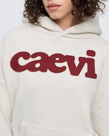 CAEVI Statement Heavyweight Hoodie in Oatmeal – model styling view