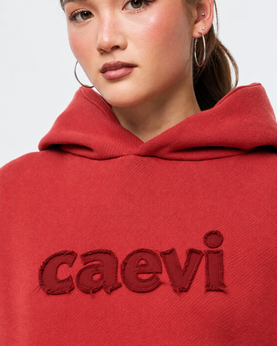 CAEVI Appliqué Heavyweight Hoodie in Crimson – model styling view