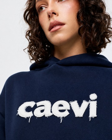 CAEVI Appliqué Heavyweight Hoodie in Navy – logo detail and fit view