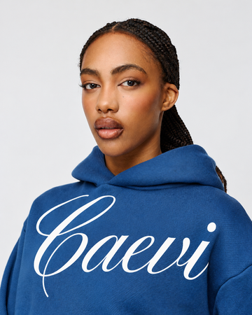 CAEVI Calligraphy Heavyweight Hoodie in Royal Blue – model styling view